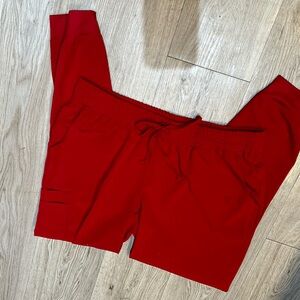 Sketchers, red scrubs pants